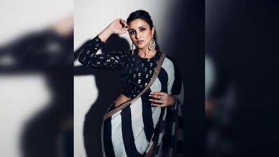 Parineeti Chopra teamed her modern saree with chandbalis and a ring. (Instagram/@parineetichopra) Parineeti Chopra teamed her modern saree with chandbalis and a ring. (Instagram/@parineetichopra)