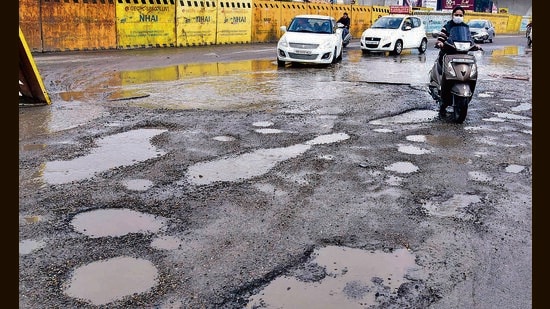 A pothole-ridden stretch on the Forzepur Road in Ludhiana on Friday. (Gurpreet Singh/HT)