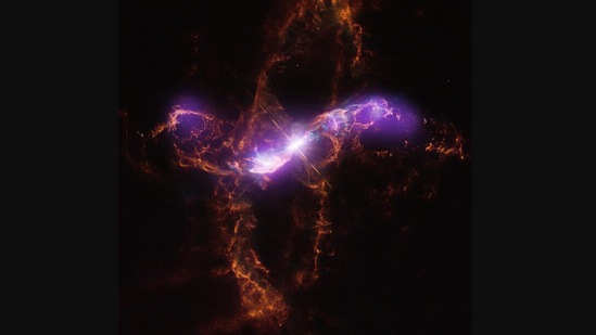 The image posted by Nasa shows a white dwarf star and a red giant orbit each other.(Instagram/@nasa)