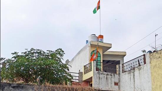 A Tricolour and a BJP flag on Sachin Sharma’s rooftop. (Sourced)