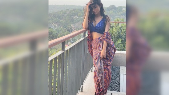 In the pictures, Mouni Roy can be seen vibing in her balcony donning a boho-chic outfit.(Instagram/@imouniroy)