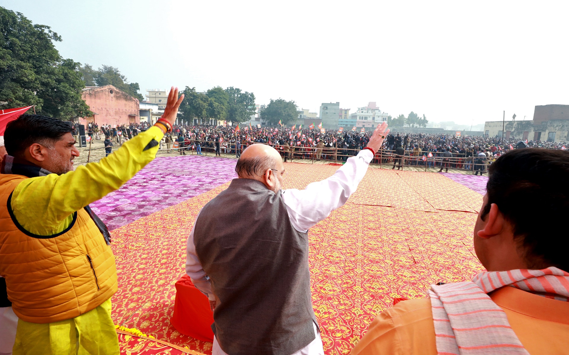 Union Home Minister Amit Shah waves to the Bharatiya Janata Party (BJP) supporters during a public meeting at Atrauli, in Aligarh on Wednesday. (ANI)