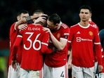 Manchester United's Anthony Elanga is consoled by teammates after missing his penalty during the shoot-out