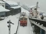 A screengrab from the video that shows a train running amid snowfall in Shimla. (twitter/@ANI) A screengrab from the video that shows a train running amid snowfall in Shimla. (twitter/@ANI)