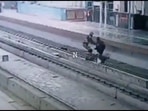 A CISF personnel helps the man climb up on the platform, who slipped and fell down on the track of Delhi's Shahdara Metro Station, on Saturday, February 5, 2022. (Screengrab/CISF Twitter) A CISF personnel helps the man climb up on the platform, who slipped and fell down on the track of Delhi's Shahdara Metro Station, on Saturday, February 5, 2022. (Screengrab/CISF Twitter)