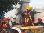 Punjab AAP chief Bhagwant Mann campaigning at Katron village in Dhuri on Wednesday. (HT Photo)