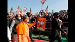 Chief minister Yogi Adityanath arrives to address an election rally in Shamli on Saturday. (Agency)