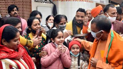 Chief minister Yogi Adityanath interacts with children during his visit to Gopal Mandir, in Gorakhpur where he conducted a doorstep campaign for the UP polls on Saturday. (PTI PHOTO) Chief minister Yogi Adityanath interacts with children during his visit to Gopal Mandir, in Gorakhpur where he conducted a doorstep campaign for the UP polls on Saturday. (PTI PHOTO)