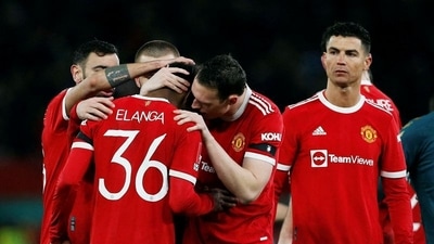 Manchester United's Anthony Elanga is consoled by teammates after missing his penalty during the shoot-out (REUTERS)