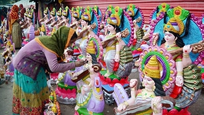 An artist gives finishing touches to an idol of Goddess Saraswati on the eve of Basant Panchami festival, in Gurugram on Friday. (ANI Photo) An artist gives finishing touches to an idol of Goddess Saraswati on the eve of Basant Panchami festival, in Gurugram on Friday. (ANI Photo)