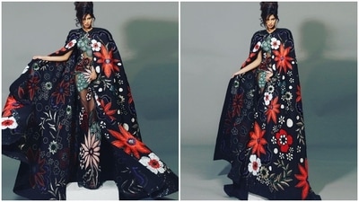 The extravagant floral work comes in multi-coloured hues, and Harnaaz teamed it with a matching cape. She wore a black floor-sweeping cape replete with floral applique work in different colours. (Instagram/@fadilberishaphotography) The extravagant floral work comes in multi-coloured hues, and Harnaaz teamed it with a matching cape. She wore a black floor-sweeping cape replete with floral applique work in different colours. (Instagram/@fadilberishaphotography)