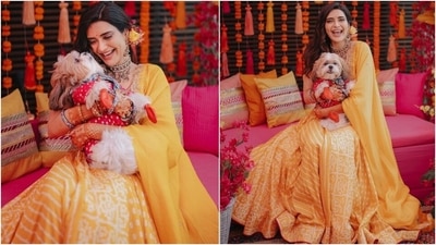 Karishma styled the lehenga set with an ornate choker necklace, matching bracelets and earrings. Side parted open locks adorned with a floral hair accessory, minimal dewy-base make-up, nude lip shade, heavy mascara on the lashes, and dainty bindi completed the glam picks. (Instagram/@karishmaktanna)