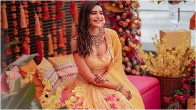 Karishma shared several photos with her fans that showed the star posing with Varun for a romantic click, enjoying a moment with her adorable pet dog, showing off her bridal glow, twirling in her lehenga and smiling brightly. The pictures have the internet collectively going, Aww. (Instagram/@karishmaktanna)