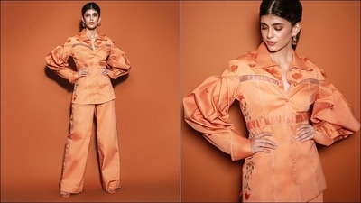 Co-ords are the celebrity approved outfits that are fast replacing sundresses and beach shorts that have been the ultimate fashion essentials for an exotic holiday to the beach. Not just for vacations, co-ord sets seamlessly fit into every fashion category be it workwear, casual or occasion wear courtesy their breathable fabric, minimal designs and vibrant, colourful and printed looks. Completing her attire with a pair of orange heels, Sanjana pulled back her silky luscious tresses into a mid-parted ponytail hairstyle to flaunt a pair of golden hoop earrings. &nbsp; (Instagram/vandafashionagency)