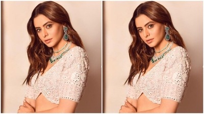 Aamna paired a midriff-baring white blouse with long sleeves with a pastel flowy skirt. Aamna's lehenga came with intricate embroidery details in white resham threads and silver mirror work. (Instagram/@aamnasharifofficial)