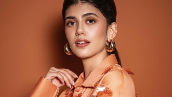 As we edge towards loungewear,, given the lazy fashion attitude that has been instilled by months of Covid-19 lockdown, Bollywood hottie Sanjana Sanghi is making sure that our spring-summer wardrobe still looks bright and impactful and her latest viral pictures in an orange backless organza co-ord set are enough to back our claim.  (Instagram/vandafashionagency)