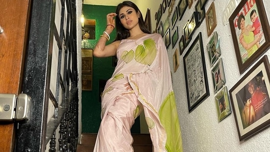 Taking to her social media handle, Mouni shared a slew of pictures featuring her in a lilac pure silk saree that sported hand-painted green anthuriums and was enhanced with hand embroidered gota along with a zig zag gota border.&nbsp;(Instagram/imouniroy)