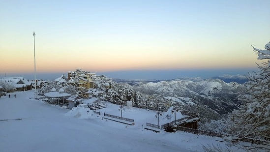 Mall Road covered with a thick layer of snow following heavy snowfall, in Shimla.(ANI)