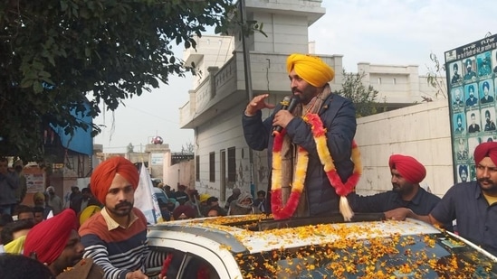 Punjab AAP chief Bhagwant Mann campaigning at Katron village in Dhuri on Wednesday. (HT Photo) Punjab AAP chief Bhagwant Mann campaigning at Katron village in Dhuri on Wednesday. (HT Photo)