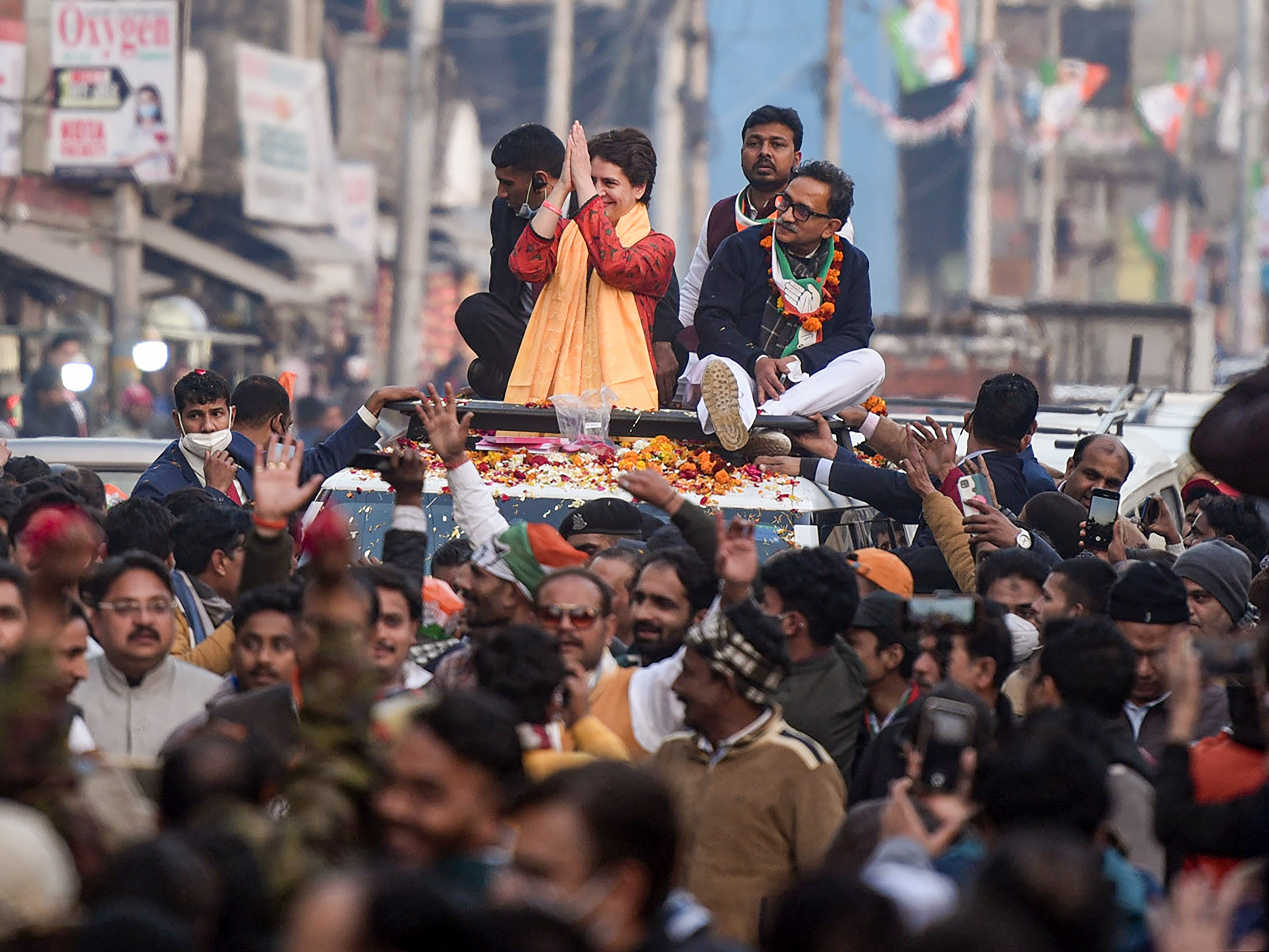 Congress general secretary Priyanka Gandhi Vadra during a roadshow in support of party candidate Vivek Bansal, ahead of upcoming UP assembly elections, in Aligarh, on Saturday, February 5, 2022. (PTI Photo) Congress general secretary Priyanka Gandhi Vadra during a roadshow in support of party candidate Vivek Bansal, ahead of upcoming UP assembly elections, in Aligarh, on Saturday, February 5, 2022. (PTI Photo)