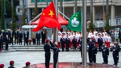 Policemen perform a flag raising ceremony in Macao, marking the 22nd anniversary of the former Portuguese colony's handover to Chinese rule. (Cheong Kam Ka/Xinhua via AP) (Xinhua via AP) Policemen perform a flag raising ceremony in Macao, marking the 22nd anniversary of the former Portuguese colony's handover to Chinese rule. (Cheong Kam Ka/Xinhua via AP) (Xinhua via AP)