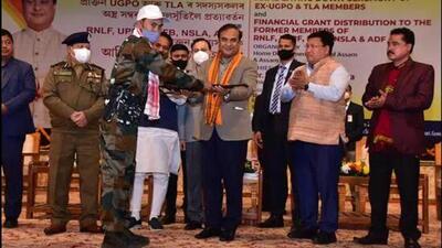 An insurgent handing over arms to Assam Chief Minister Himanta Biswa Sarma at Guwahati last month. (TWITTER/@Himanta Biswa Sarma.)