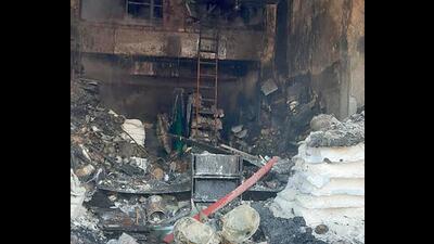 The charred remains of the hardware and paint unit on Rahon Road in Ludhiana on Sunday after a fire broke out. (HT PHOTO)