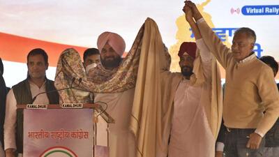 Ludhiana, India - February 06, 2022: Senior Congress leader Rahul Gandhi and Punjab Pradesh Congress Committee (PPCC) president Navjot Singh Sindhu congratulate Punjab Chief Minister Charanjit Singh Channi after the announcement of his name as the Congress CM candidate during a virtual rally, in Ludhiana, Punjab, India on Sunday, February 06, 2022. (Photo by Gurpreet Singh/Hindustan Times) Ludhiana, India - February 06, 2022: Senior Congress leader Rahul Gandhi and Punjab Pradesh Congress Committee (PPCC) president Navjot Singh Sindhu congratulate Punjab Chief Minister Charanjit Singh Channi after the announcement of his name as the Congress CM candidate during a virtual rally, in Ludhiana, Punjab, India on Sunday, February 06, 2022. (Photo by Gurpreet Singh/Hindustan Times)
