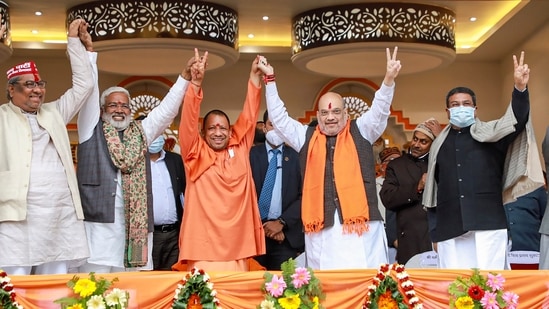 Union Home Minister Amit Shah with chief minister Yogi Adityanath during a public meeting ahead of the UP Assembly elections. (FILE PHOTO)