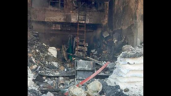 The charred remains of the hardware and paint unit on Rahon Road in Ludhiana on Sunday after a fire broke out. (HT PHOTO)