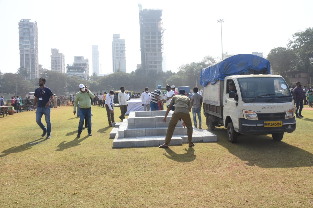 Workers preparing the grounds for the funeral. Workers preparing the grounds for the funeral.