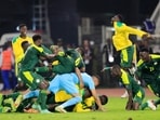 Sadio Mane celebrates with teammates after scoring the winning penalty in the shoot out