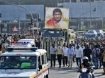 A military vehicle carrying the body of legendary singer Lata Mangeshkar moves through a road in Mumbai on Sunday.