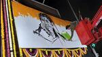 An artist making a sketch of Lata Mangeshkar as a tribute to her in Mumbai on Sunday. (ANI)