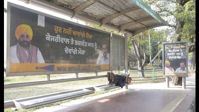 A hoarding put up by AAP in Mohali ahead of the Punjab assembly elections. (Keshav SIngh/HT)