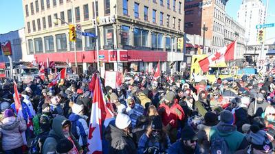 Protestors of the vaccine mandates implemented by Prime Minister Justin Trudeau, take in the atmosphere as they dance on the corner of Sussex and Rideau streets in Ottawa, Canada. (AFP) Protestors of the vaccine mandates implemented by Prime Minister Justin Trudeau, take in the atmosphere as they dance on the corner of Sussex and Rideau streets in Ottawa, Canada. (AFP)