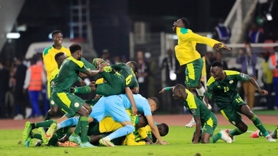 Sadio Mane celebrates with teammates after scoring the winning penalty in the shoot out (REUTERS)
