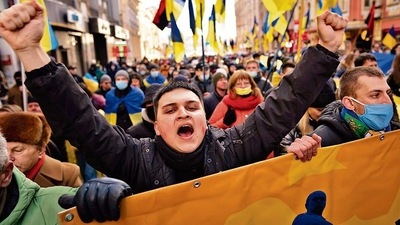 Demonstrators with Ukrainian national flags, one of them shouts, rally against Russian aggression in the center of Kharkiv, Ukraine's second-largest city. (AP Photo) Demonstrators with Ukrainian national flags, one of them shouts, rally against Russian aggression in the center of Kharkiv, Ukraine's second-largest city. (AP Photo)