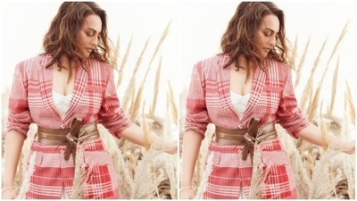 Sonakshi teamed a white attire with a red checkered jacket and completed her look with a brown leather belt at the waist. (Instagram/@aslisona)