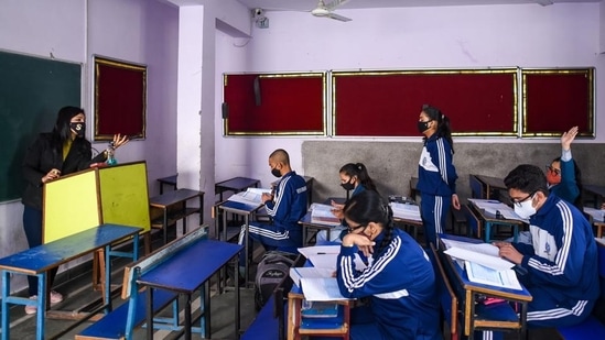 Students attend a class at a school in Mayur Vihar on Monday. (Amal KS/HT)