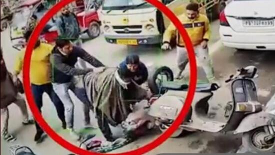 CCTV grab of the incident where a man tried to hack a woman to death in Ludhiana and was overpowered by passersby. (HT Photo)