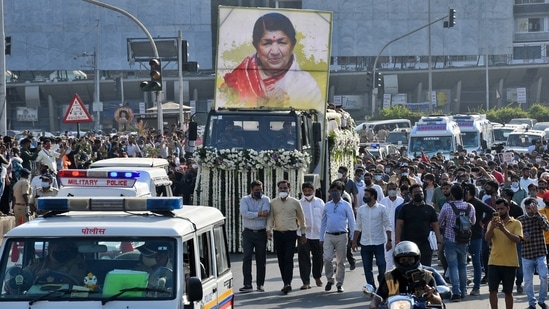 A military vehicle carrying the body of legendary singer Lata Mangeshkar moves through a road in Mumbai on Sunday.(Reuters Photo)