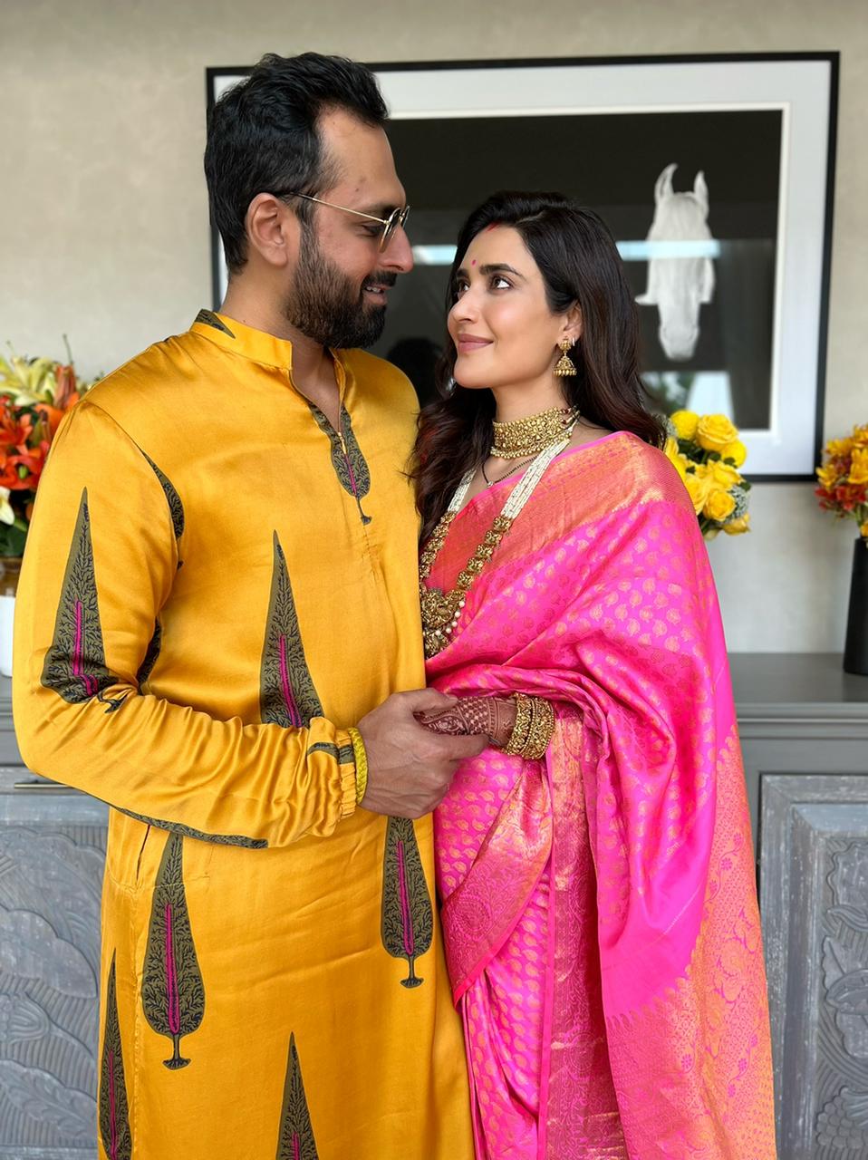 Newlyweds Karishma Tanna and Varun Bangera pose after their griha pravesh.