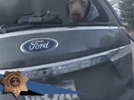 The image, taken from a Facebook video, shows the dog trapped inside a burning car. It was later rescued by the policeman.