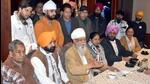 AAP leader HS Hanspal (centre) addressing the media after Congress leaders Surinder Aggarwal (extreme left) and Sunita Dhawan (extreme right) joined the party in Ludhiana on Tuesday. (HT Photo)
