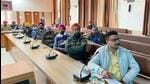 Representatives of political parties and general observers attending the randomisation process at Bachat Bhawan in Ludhiana on Tuesday. (HT Photo)