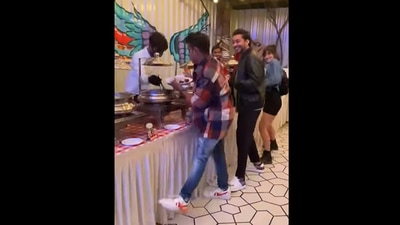 A screengrab from the video that shows dancers nailing the Srivalli hook step at a dinner buffet.&nbsp; (instagram/@razishaikh6)