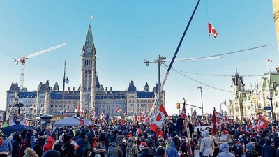 Thousands in support of the truckers gather on Wellington Street near Parliament Hill on February 5, 2022 in Ottawa, Canada. (AFP) Thousands in support of the truckers gather on Wellington Street near Parliament Hill on February 5, 2022 in Ottawa, Canada. (AFP)