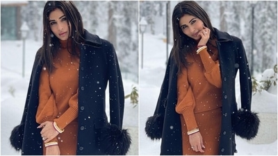 Mouni slipped into a chocolate brown ribbed sweater featuring a turtle neckline, bishop sleeves with gathered cuffs, and a fitted silhouette. The star teamed it with a matching brown bodycon skirt with a similar ribbed pattern and high-waisted hemline. (Instagram/@imouniroy)
