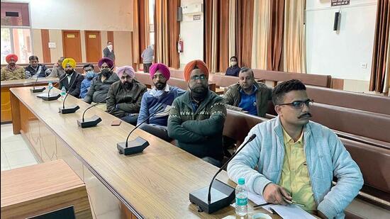 Representatives of political parties and general observers attending the randomisation process at Bachat Bhawan in Ludhiana on Tuesday. (HT Photo)